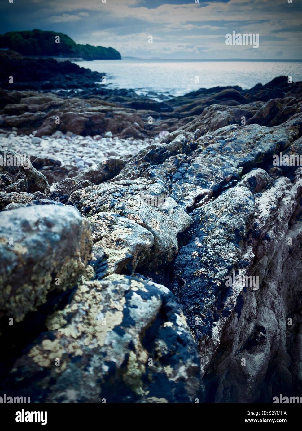 Clevedon beach moody scene by the rocks Stock Photo Alamy
