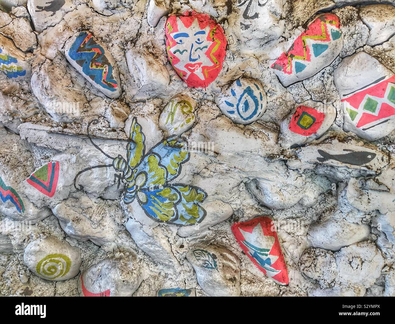 Whimsical designs painted on stones. - Smartphone Captured Stock Image
