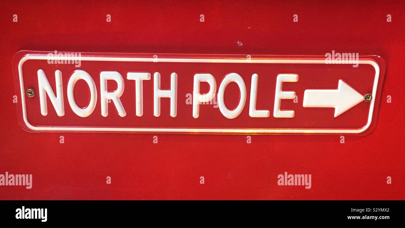 Red Nort Pole  sign with white text Stock Photo