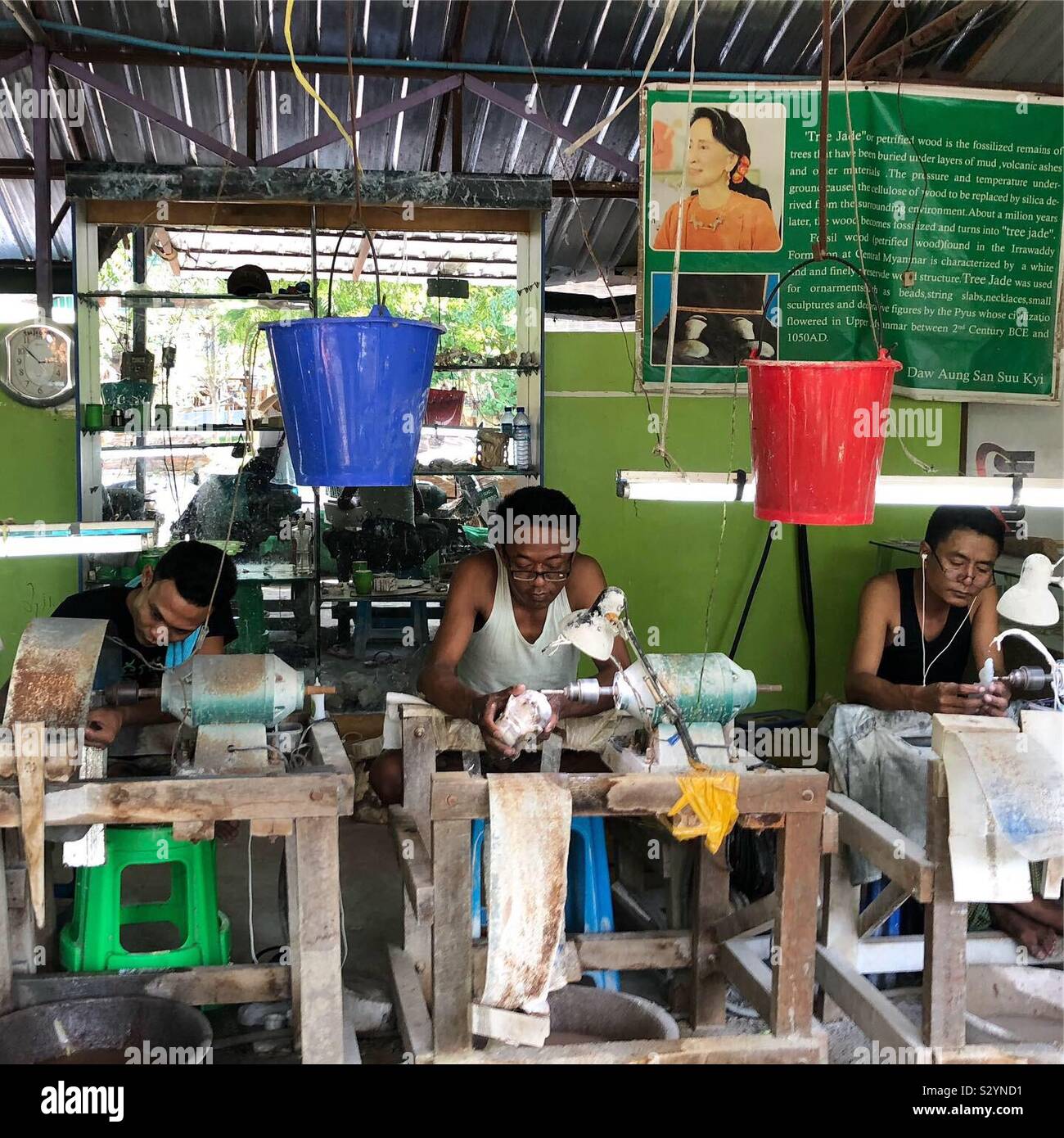 Craftsmen sculpting wood jade objects in Mandalay, Myanmar. - Smartphone Captured Stock Image