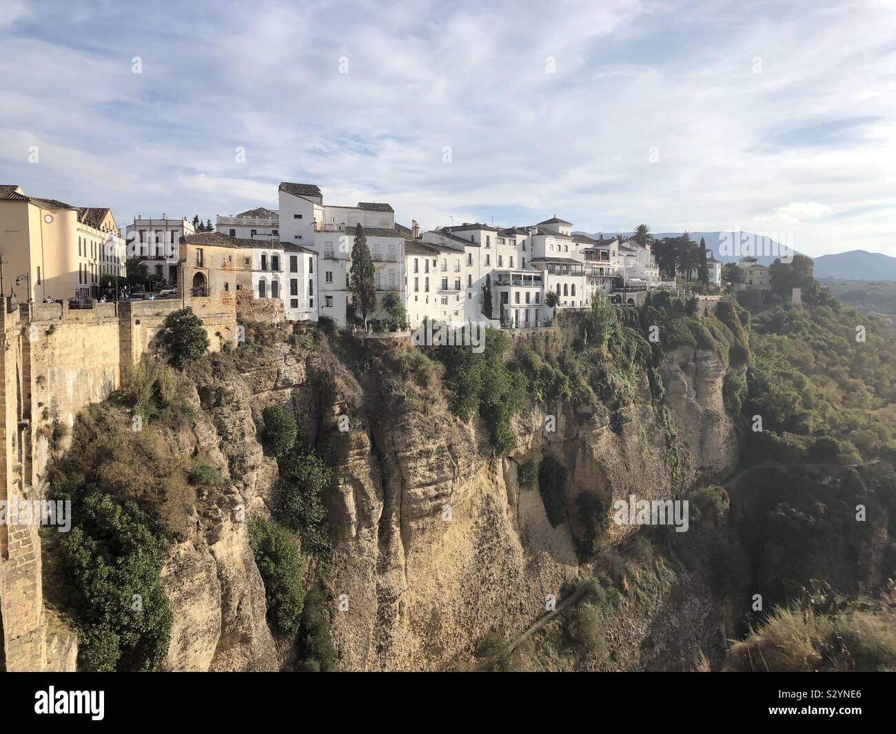 Houses along the edge of the gorge in Ronda, Spain - Smartphone Captured Stock Image