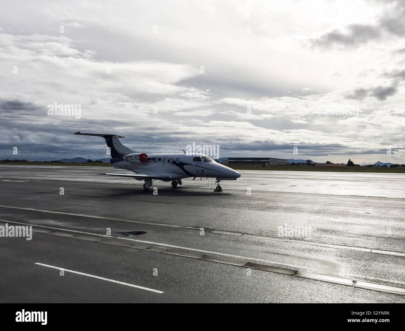 Embraer Phenom 100 private jet at Biarritz airport, France. Stock Photo