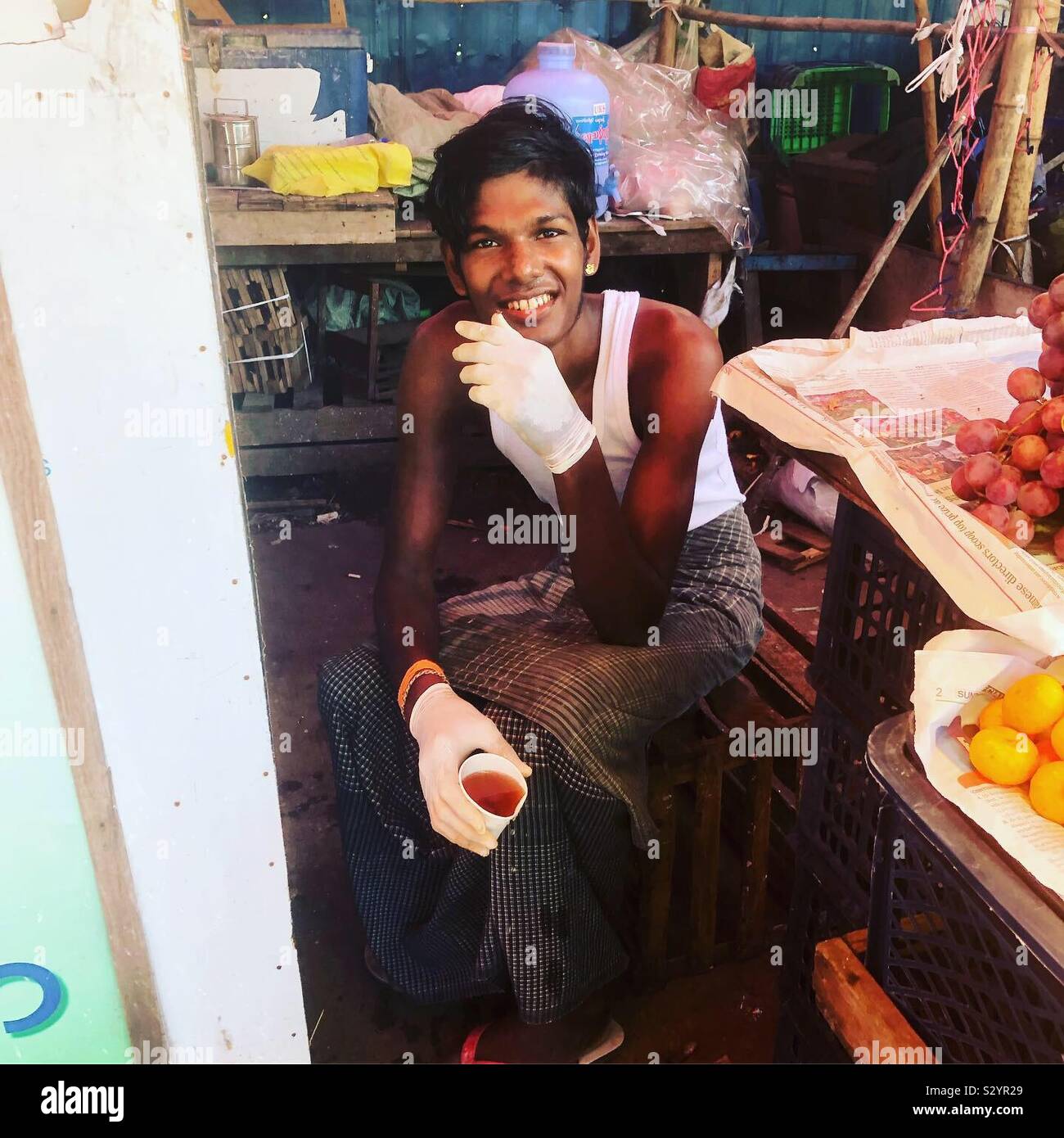 Young male street vendor in Yangon, Myanmar. - Smartphone Captured Stock Image