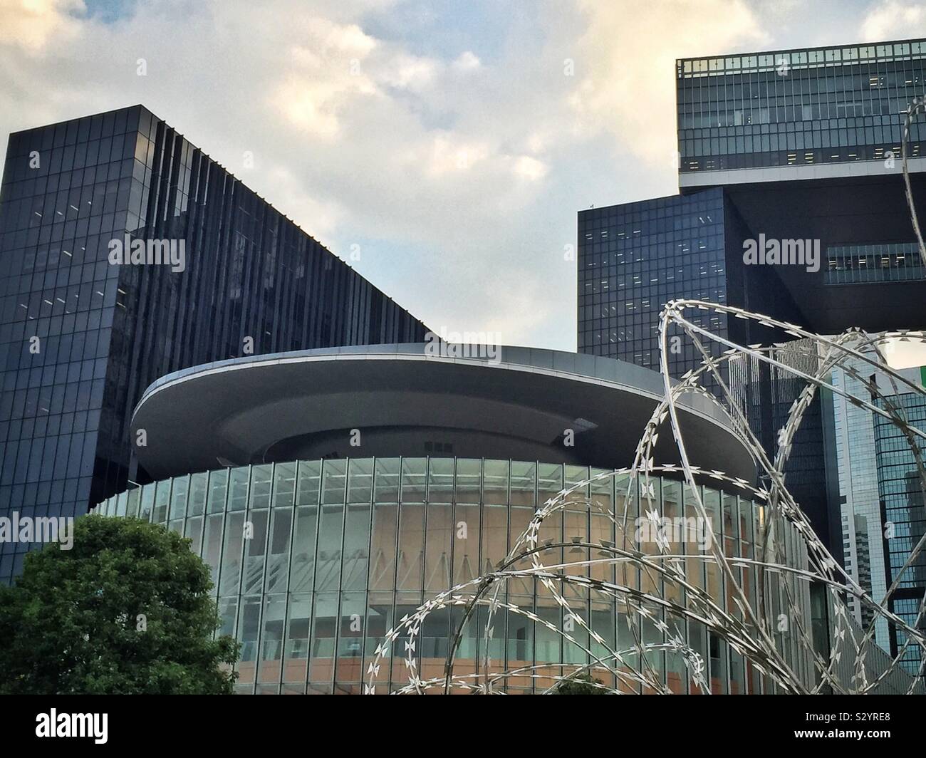 The new face of Hong Kong: the Legislative Council building barricaded behind razor wire during the protests in October 2019 - Smartphone Captured Stock Image