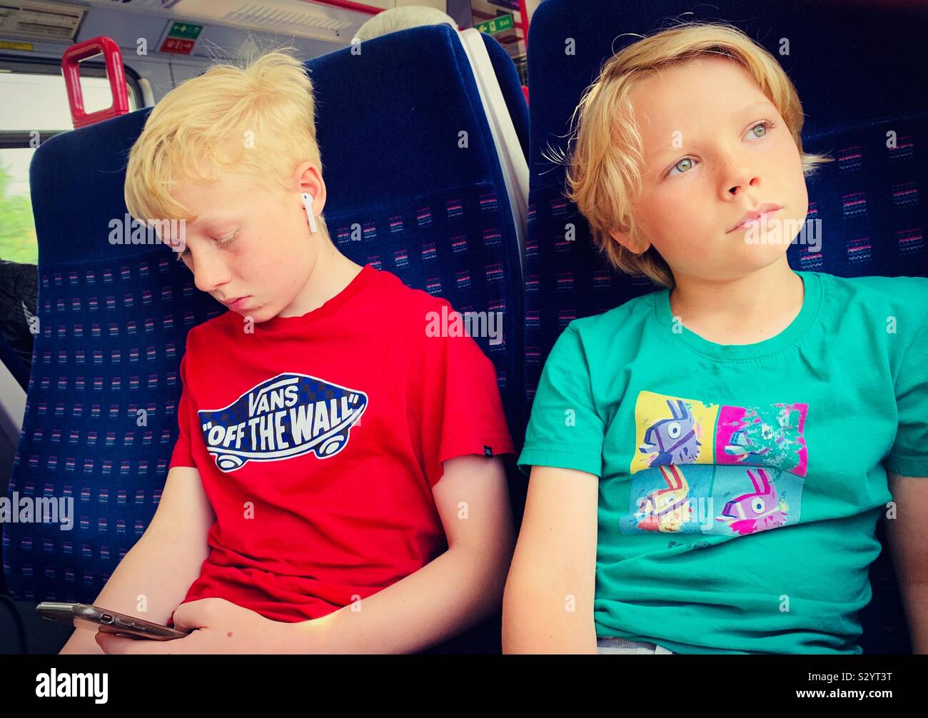 Brothers on a train - Smartphone Captured Stock Image