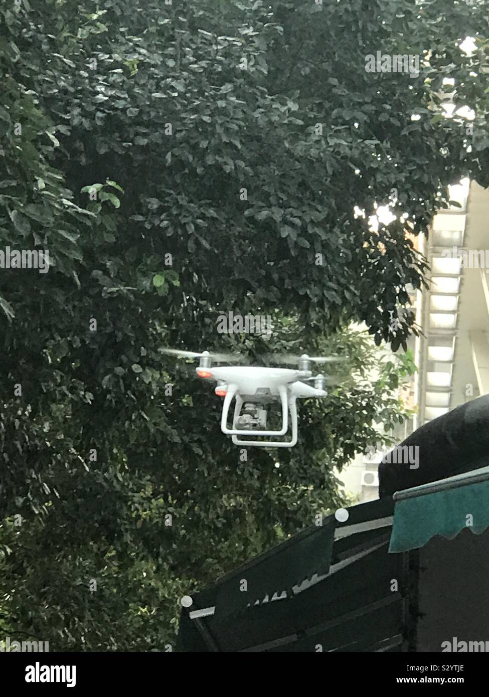 Flying Phantom: a drone on flying mode Stock Photo