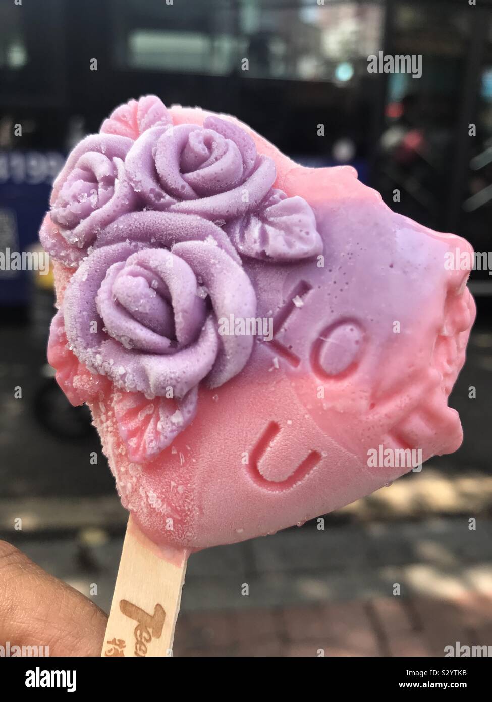 Bitten love: partially eaten ice cream with love you words Stock Photo