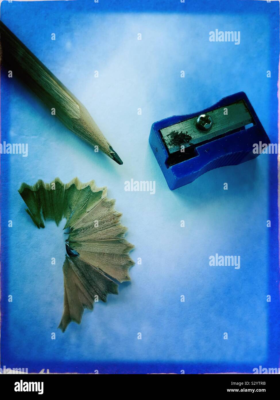 Pencil and sharpener on plain background - Smartphone Captured Stock Image