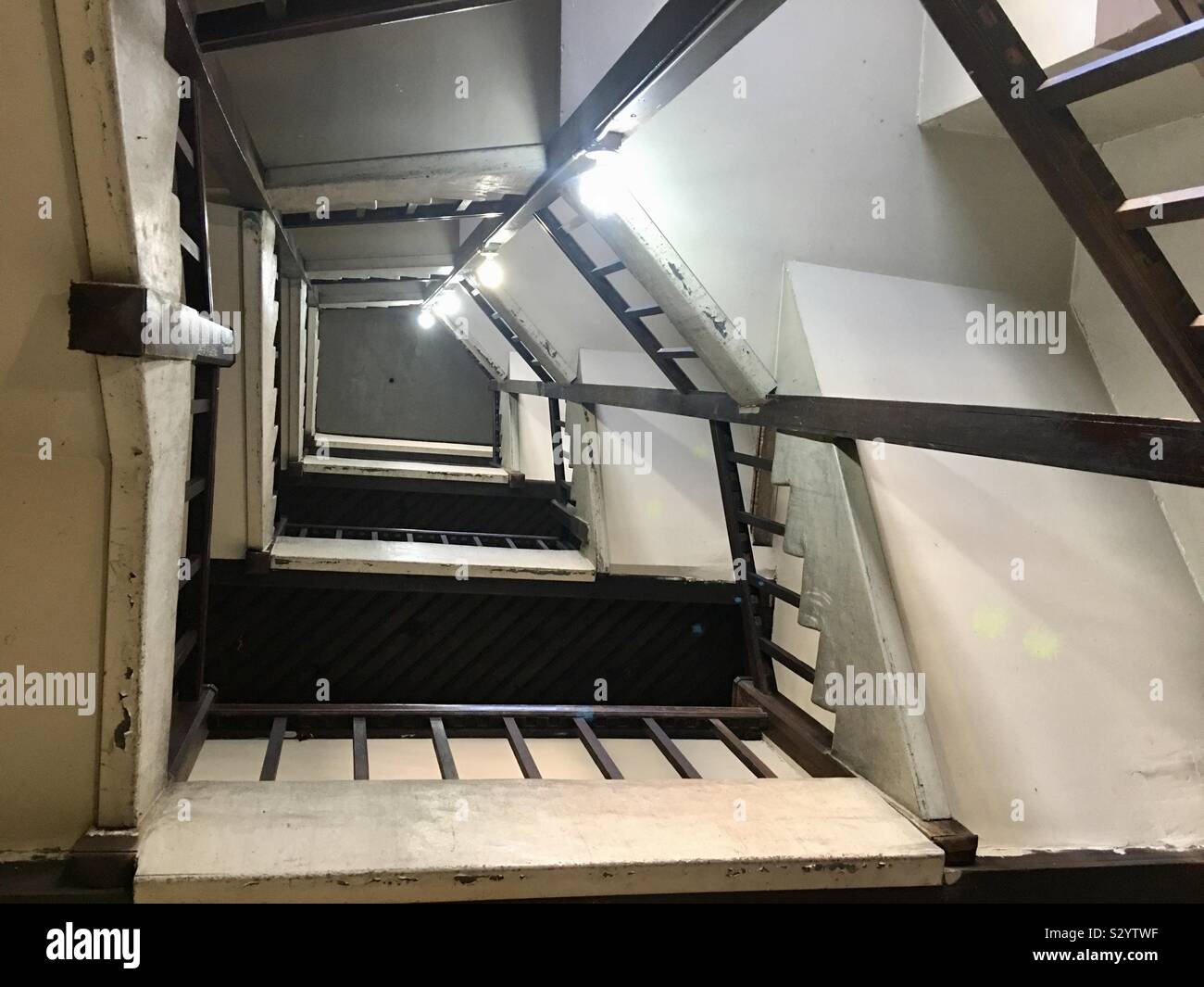 Looking up at stair well inside a building Stock Photo