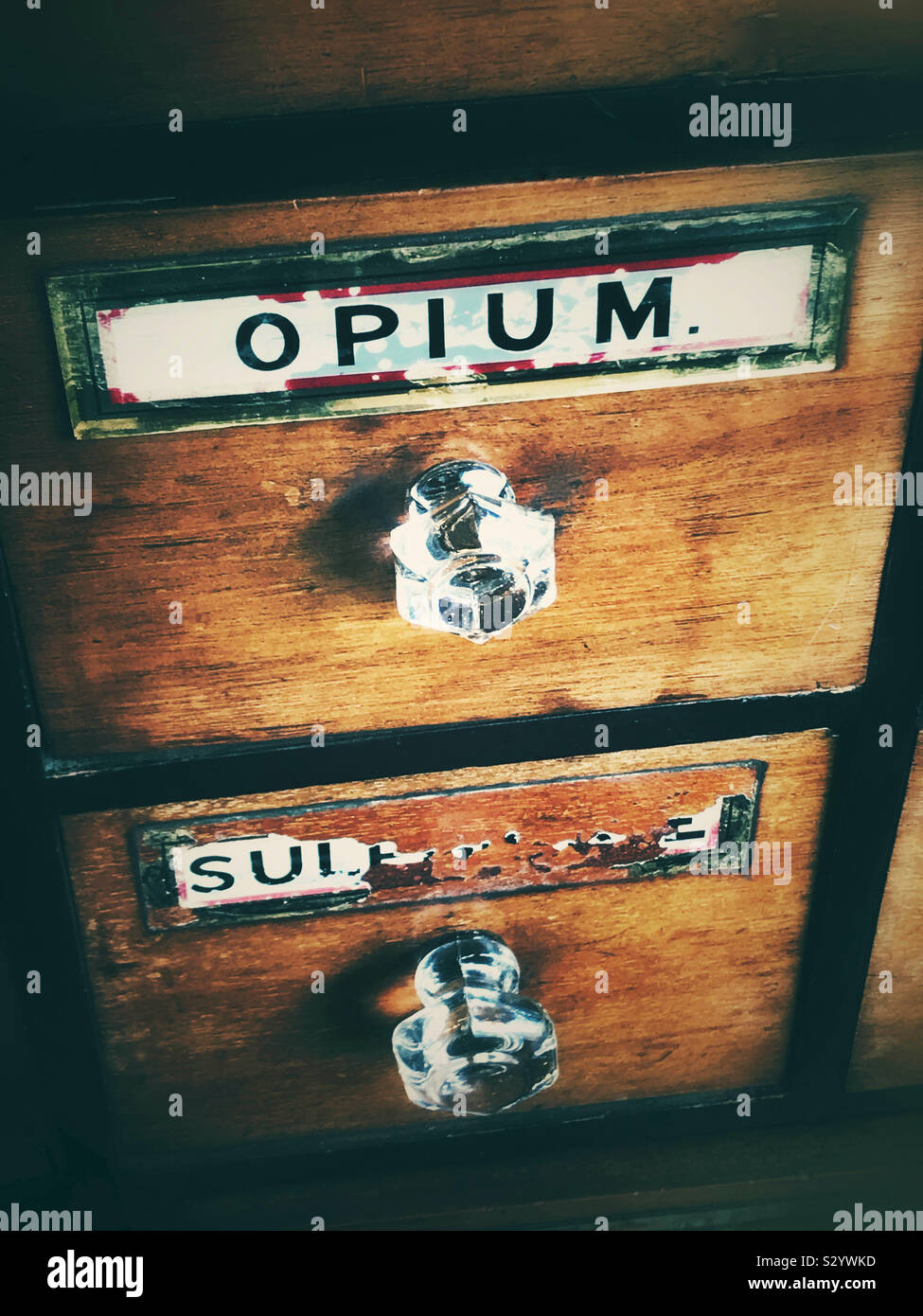 Old chest of draws with a opium label Stock Photo