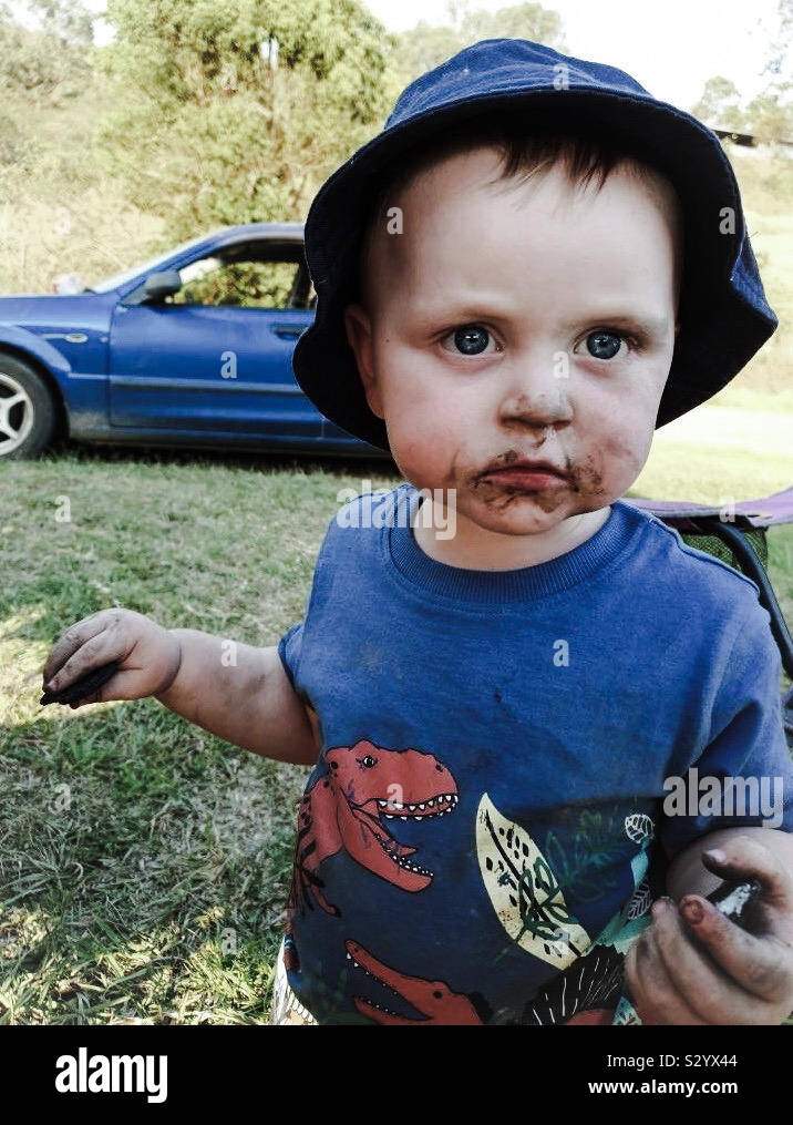 Toddler with a dirty face outside Stock Photo Alamy
