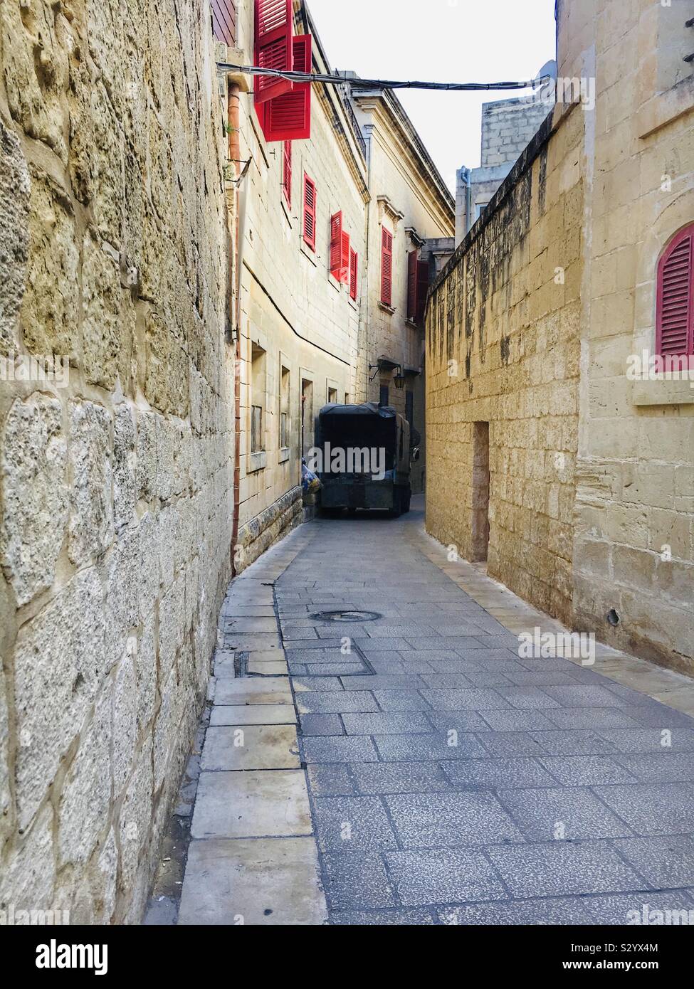 Garbage collector in Mdina, Malta Stock Photo Alamy