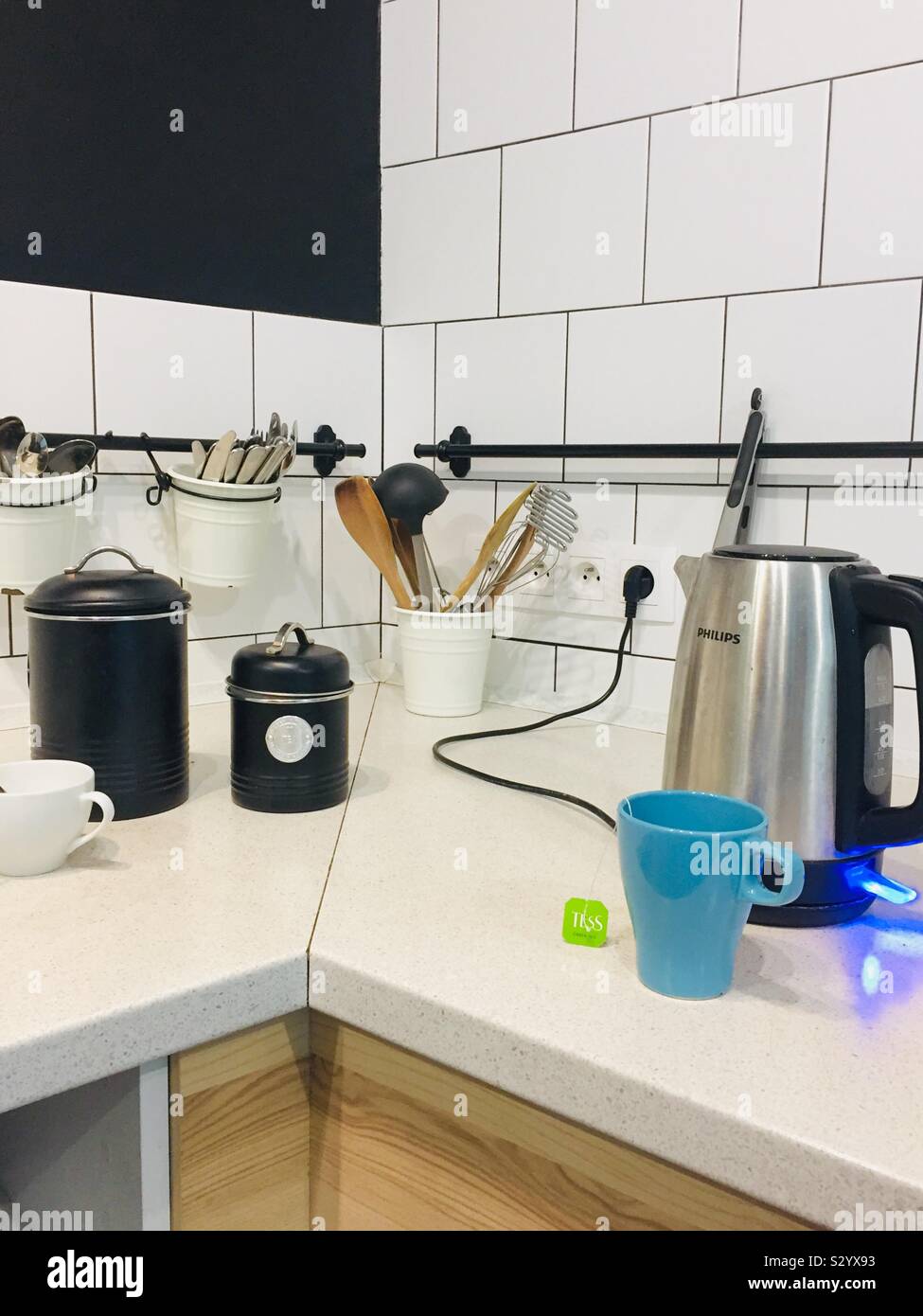 Making myself tea. Tea time. Scandinavian communal kitchen. Hostel in the Slovakian capital city. - Smartphone Captured Stock Image