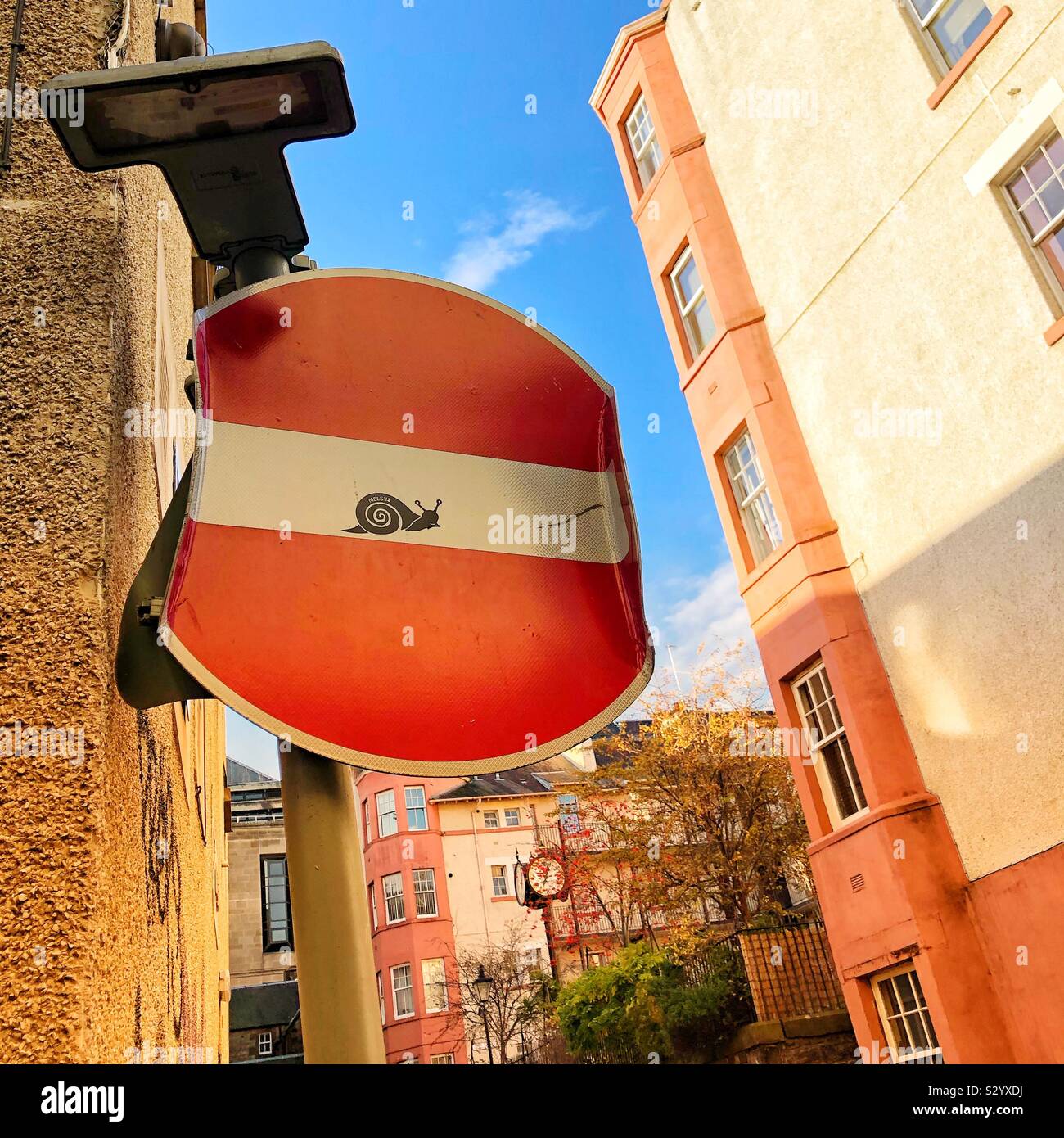 Bent No entry sign with snail - Smartphone Captured Stock Image