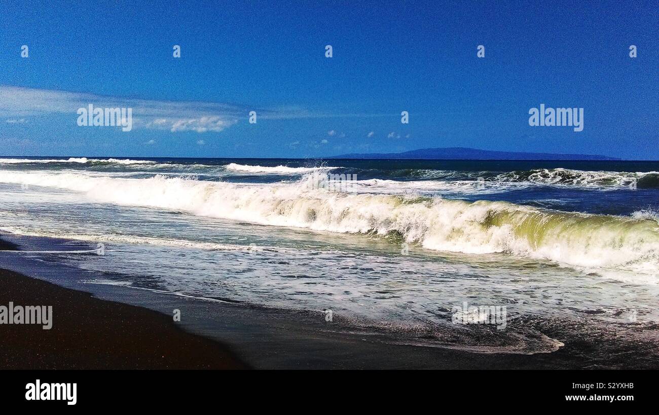 What a sweet set of waves at a deserted Balinese beach... Stock Photo