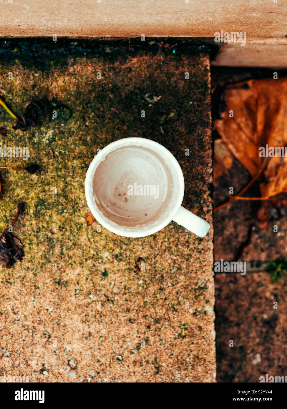 Empty mug on a concrete step - Smartphone Captured Stock Image