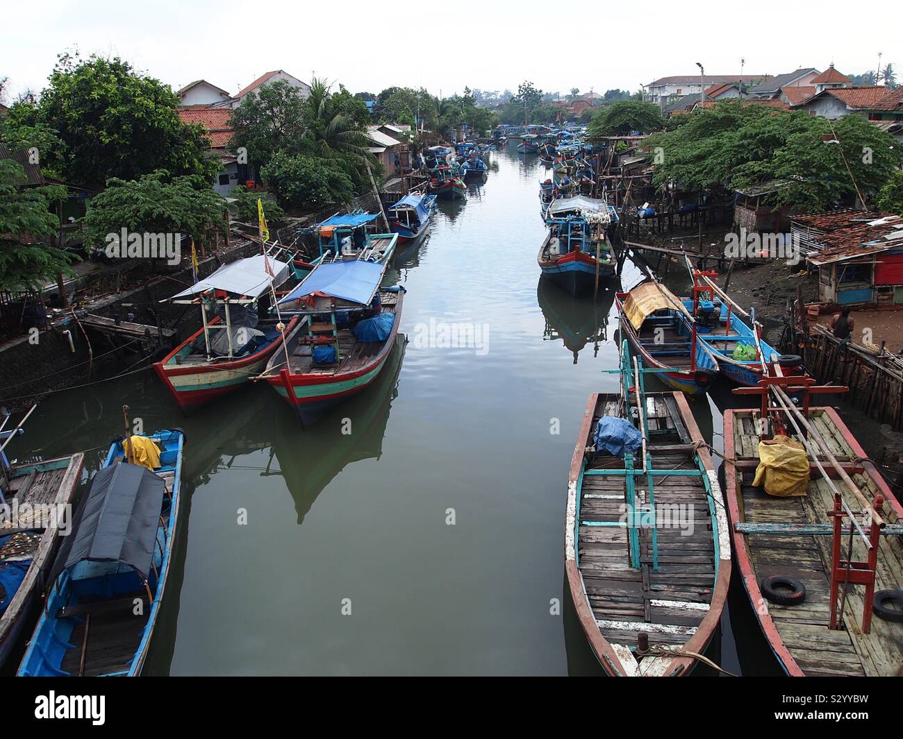 Kaliyasa or Yasa river is one of the rivers in the city of Cilacap,central Java-Indonesia and some traditional boats can be seen. Stock Photo