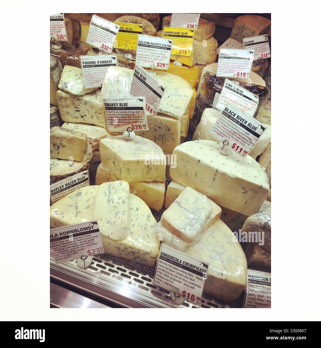 A variety of cheeses at Murray’s Cheese in Grand Central Station in New York City. - Smartphone Captured Stock Image