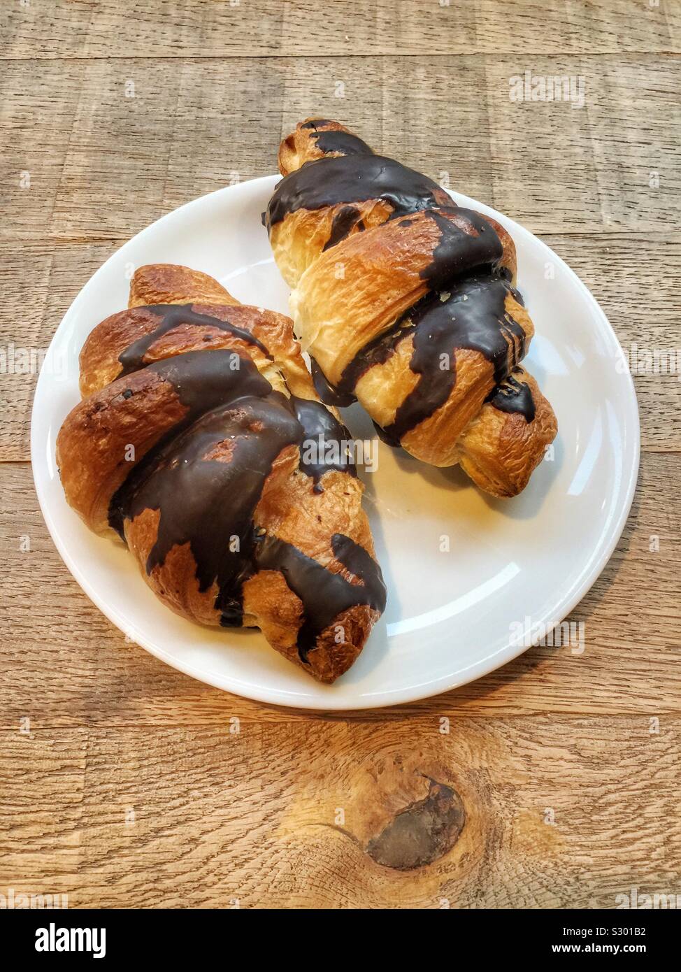 Two chocolate croissant in a plate Stock Photo