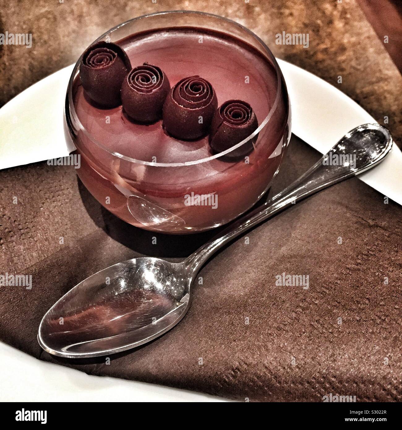 Chocolate desert with spoon Stock Photo Alamy
