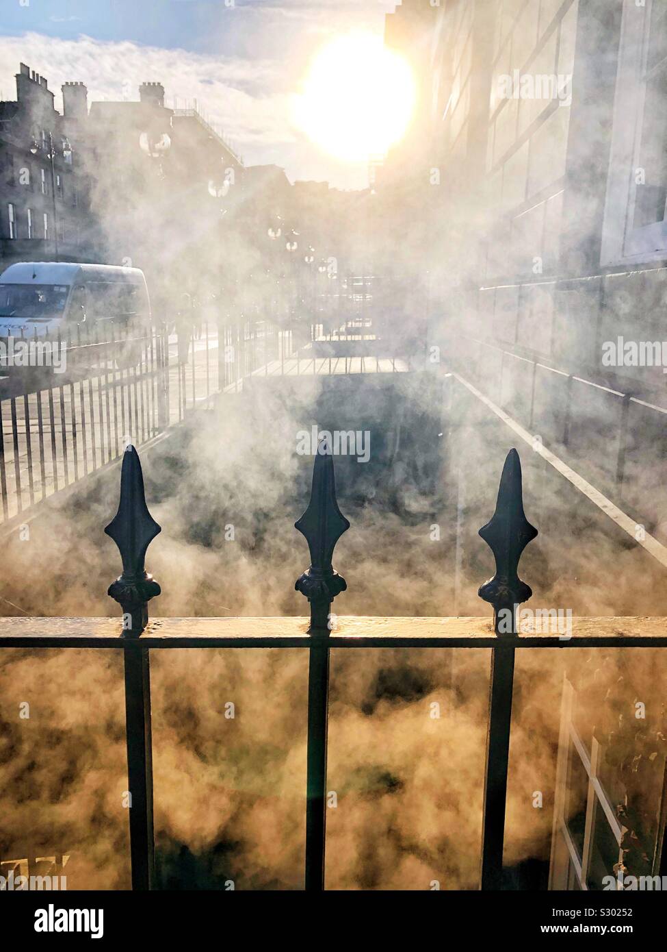 Steam rising from a basement on a cold day - Smartphone Captured Stock Image