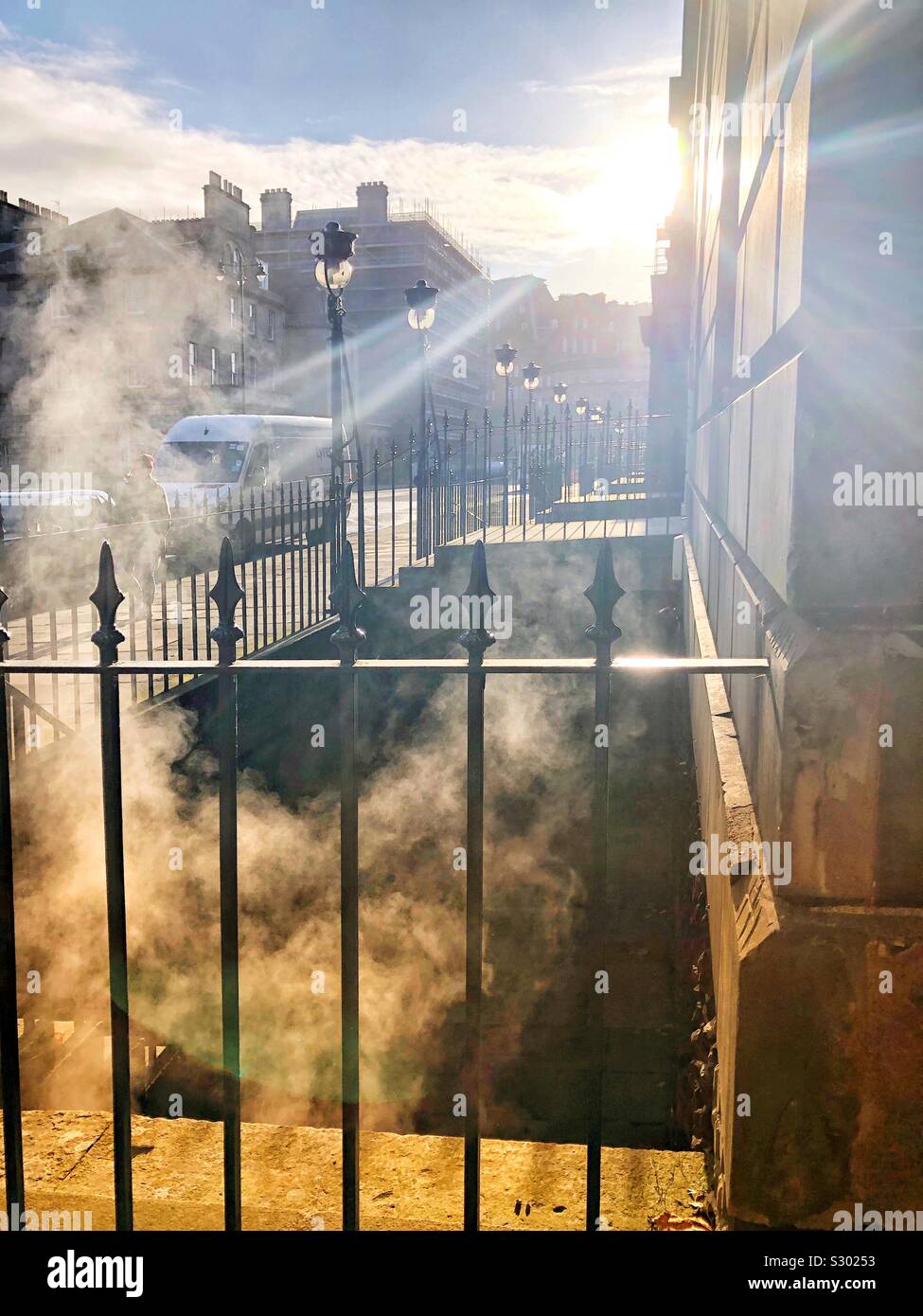 Steam rising from a basement on a cold day - Smartphone Captured Stock Image
