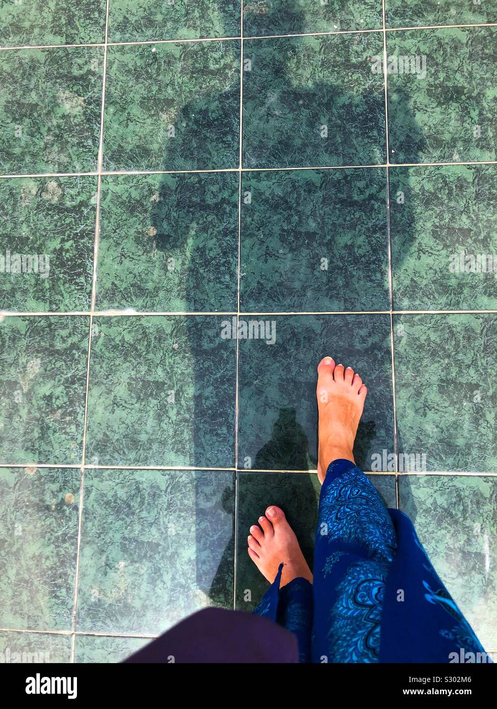 Walking barefoot in a Buddhist temple. - Smartphone Captured Stock Image