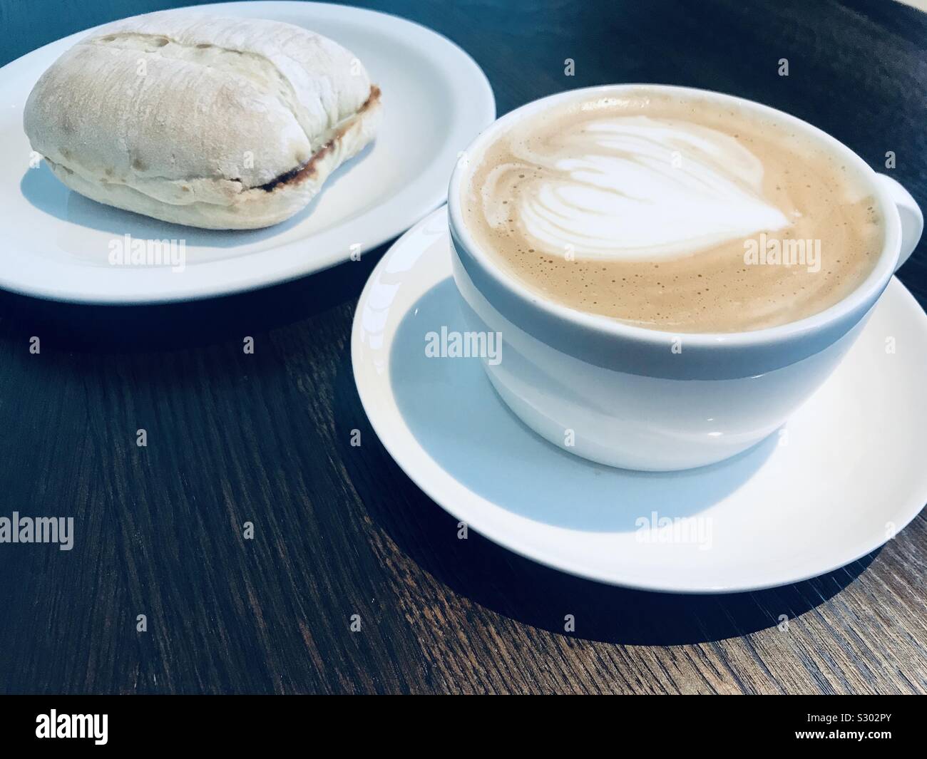 Starbucks flat white coffee with a marmite cheese toasted ciabatta
