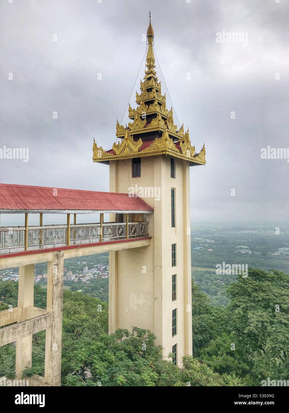 An elevator shaft takes you to the top of Mandalay Hill. Stock Photo