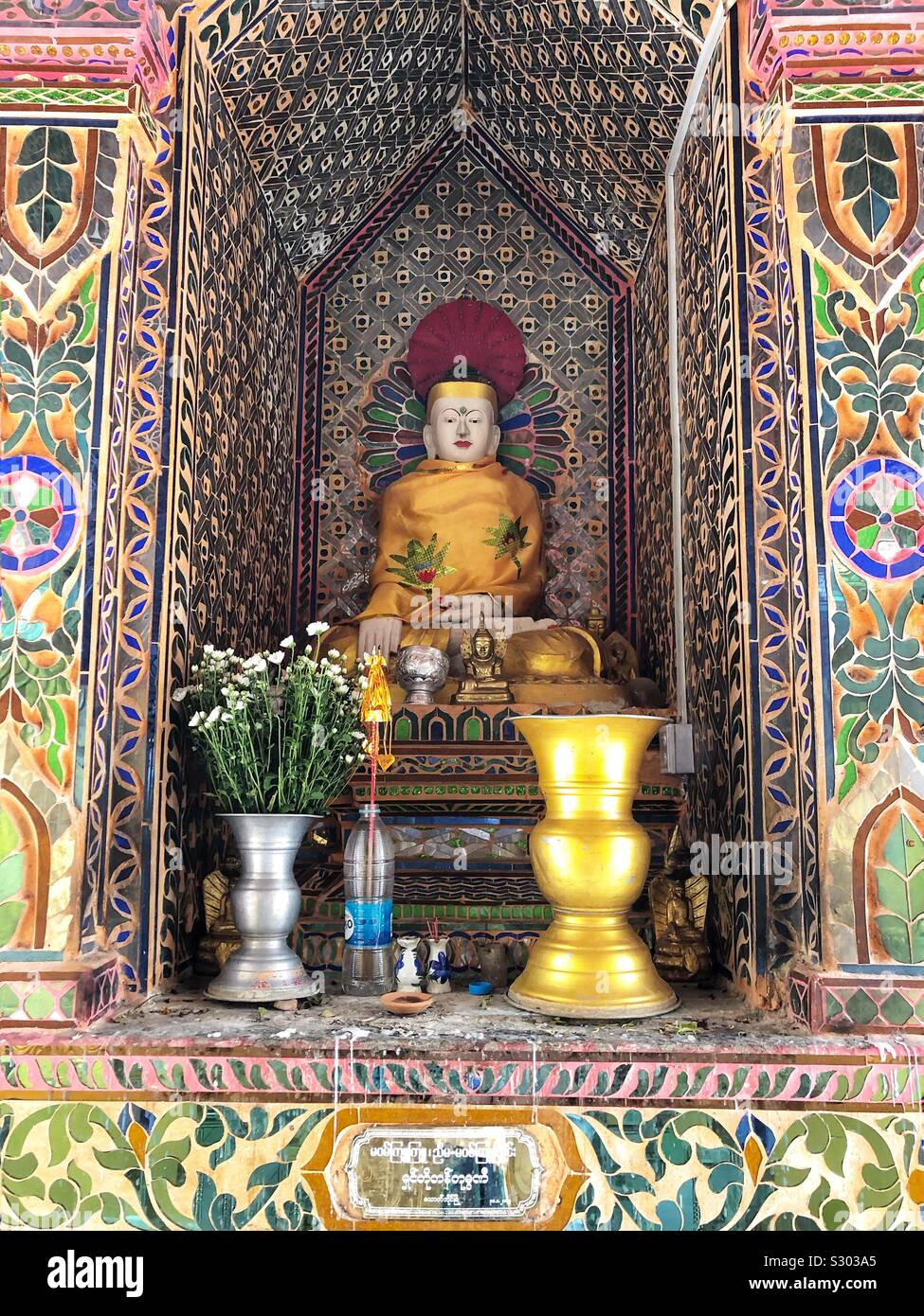 A colourful Buddhist shrine. Stock Photo