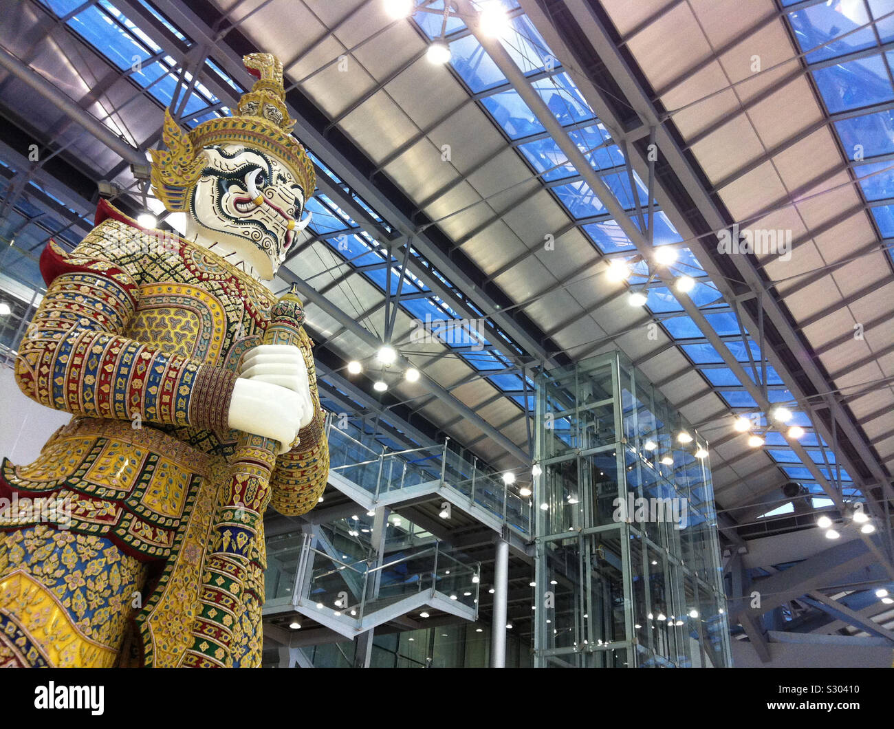 Statue in Bangkok Airport terminal building, Thailand - Smartphone Captured Stock Image