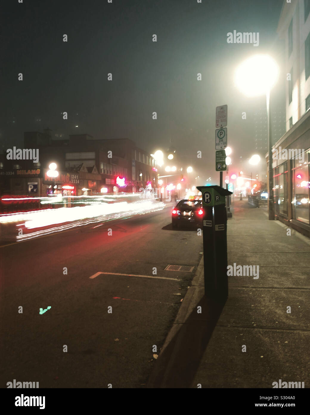 The taillight trails illuminate Dalhousie Street in Byward Market area of Ottawa, the Capital if Canada, 2019 - Smartphone Captured Stock Image
