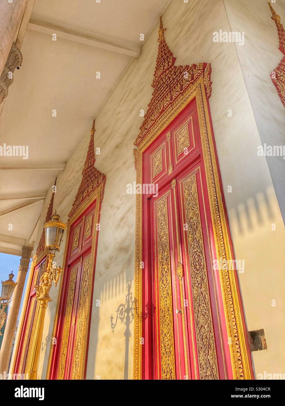 Ornate doors of a temple within the Royal Palace in Phnom Penh, Cambodia. Stock Photo