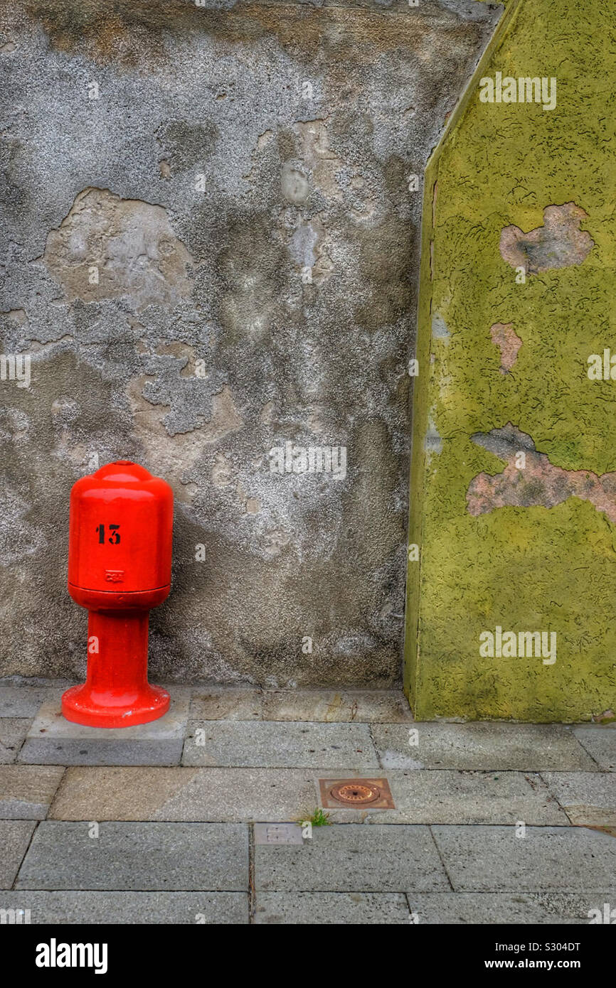 Fire hydrant by a wall Stock Photo Alamy