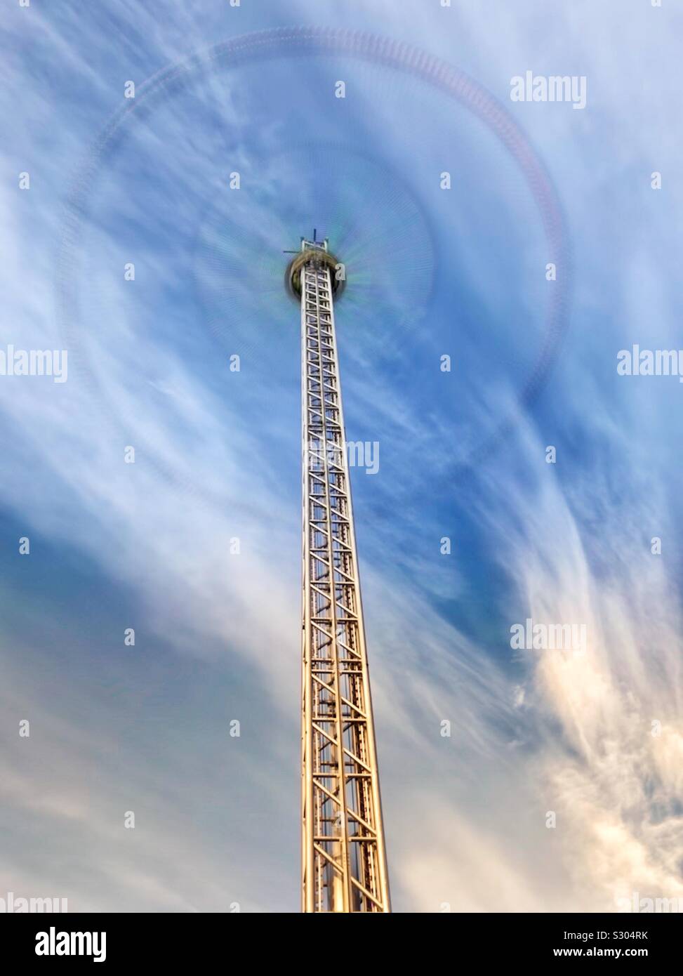 Star Flyer spinning big wheel Fairground ride at Christmas funfair with motion blur - Smartphone Captured Stock Image