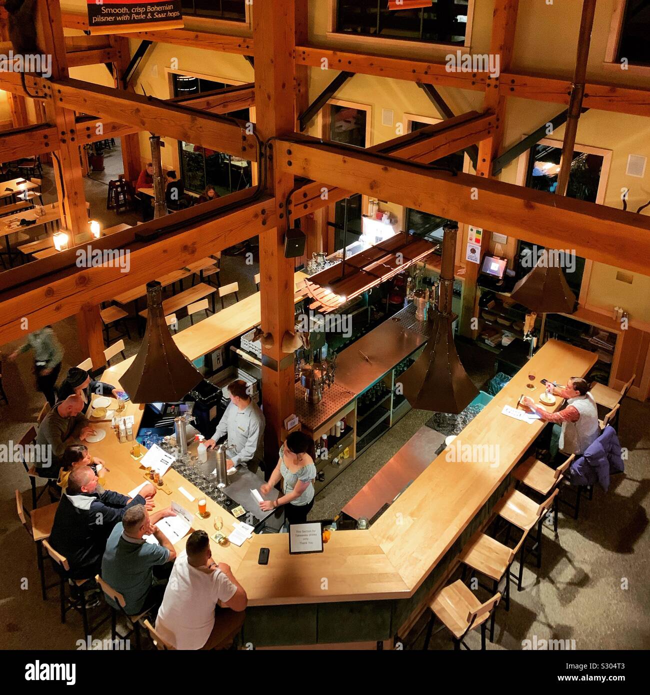 View from above of the bar at the von Trapp Brewery and Bierhall, Stowe, Vermont, United States - Smartphone Captured Stock Image