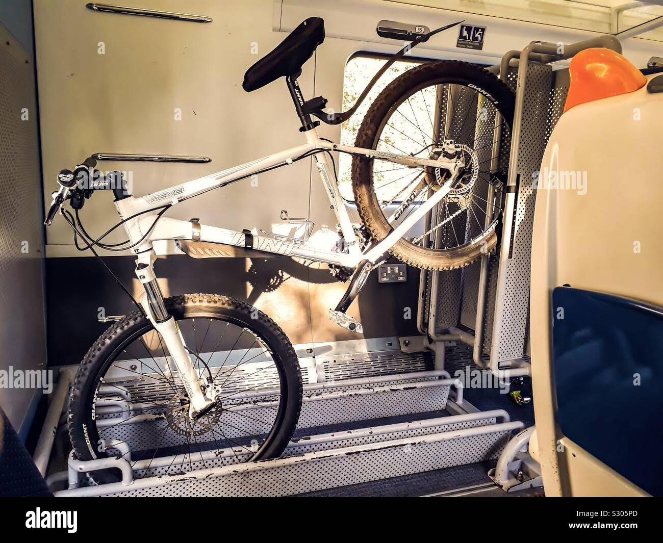 Bicycle on the rack in the Intercity train coach. Ireland Stock Photo -  Alamy