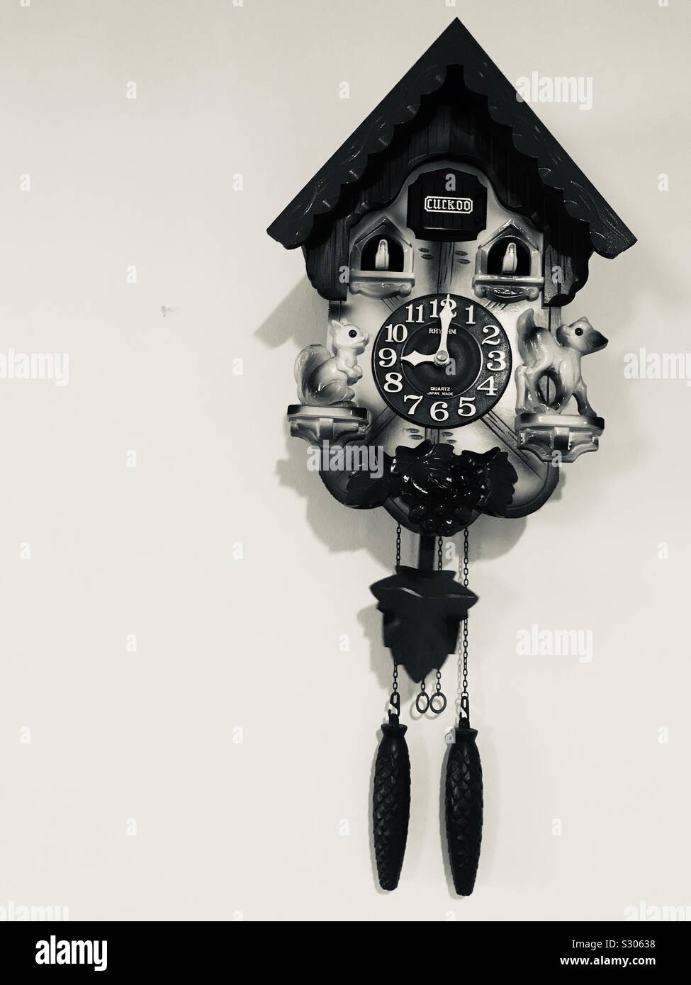 Wooden cuckoo clock hanging on the wall Stock Photo Alamy
