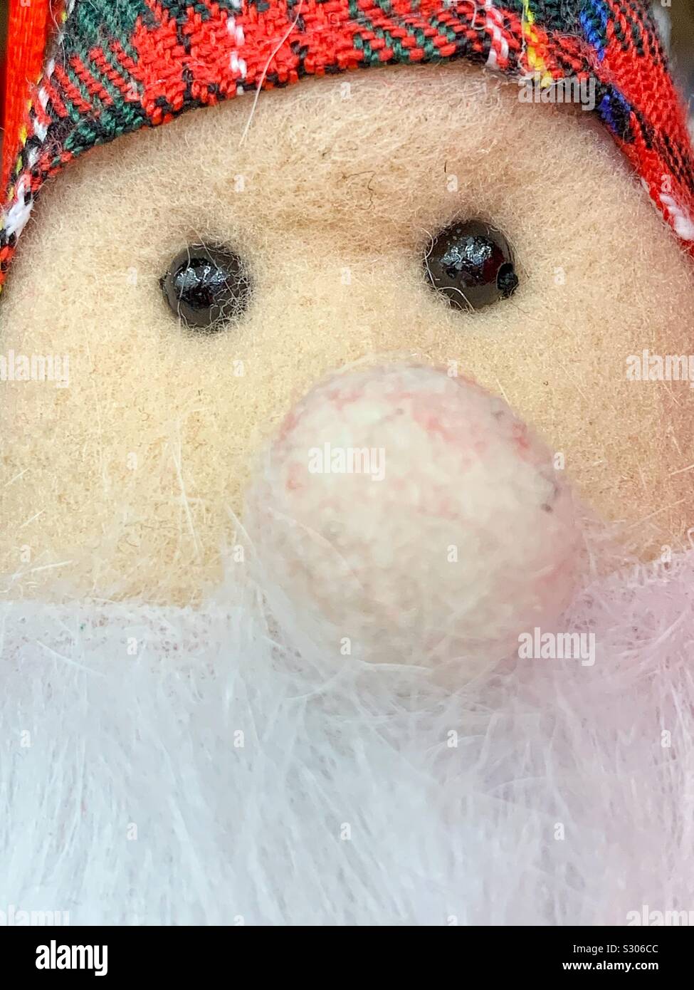 Big nose Christmas Santa stuffed animal lovie. Stock Photo