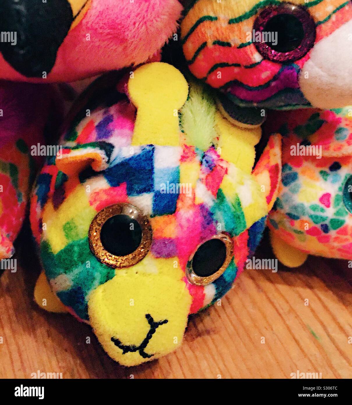 Tiny TY teddies rainbow coloured giraffe Stock Photo