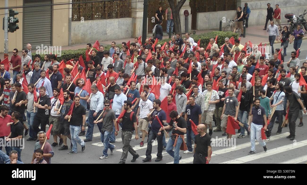 Greek Communist party members demonstrating on Panepistimiou Street in Athens, Greece. The Greek Communist Party (KKE) usually gets less than 10% of votes in Greek parliamentary elections. Stock Photo