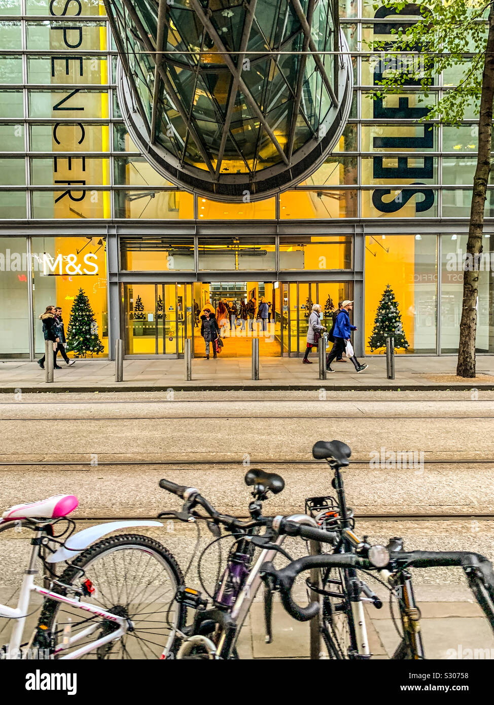 Underneath the glass tunnel bridge at Selfridges on corporation street in Manchester Stock Photo