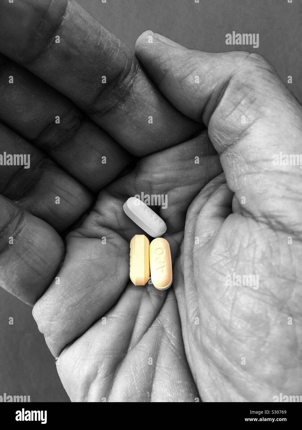 Three powerful opioids in the palm of a hand - Smartphone Captured Stock Image