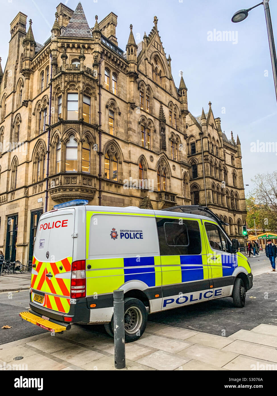 Greater Manchester police van parked next to central street and Albert Square in Manchester City centre Stock Photo