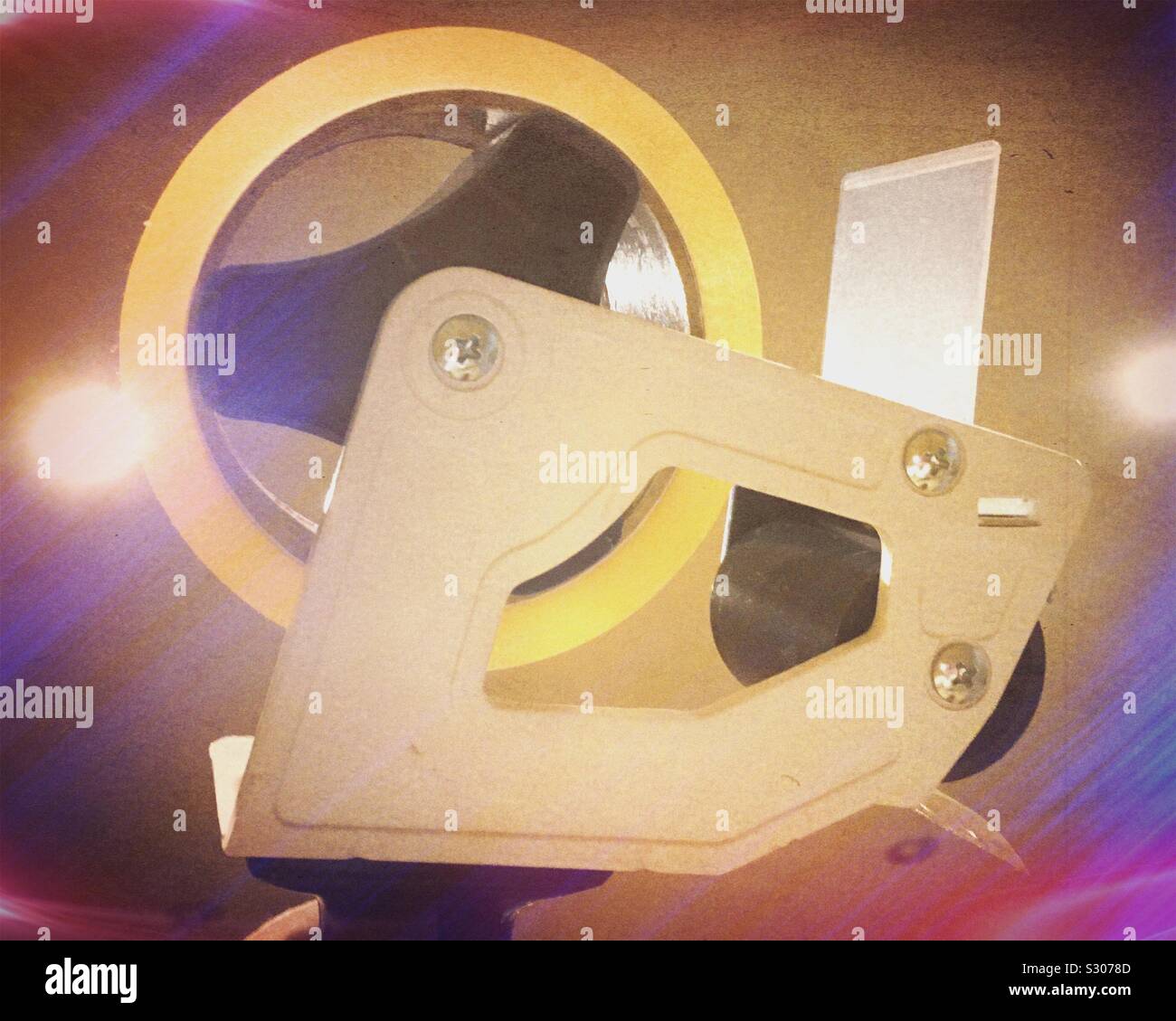 Handheld parcel tape dispenser with a roll of clear tape Stock Photo Alamy