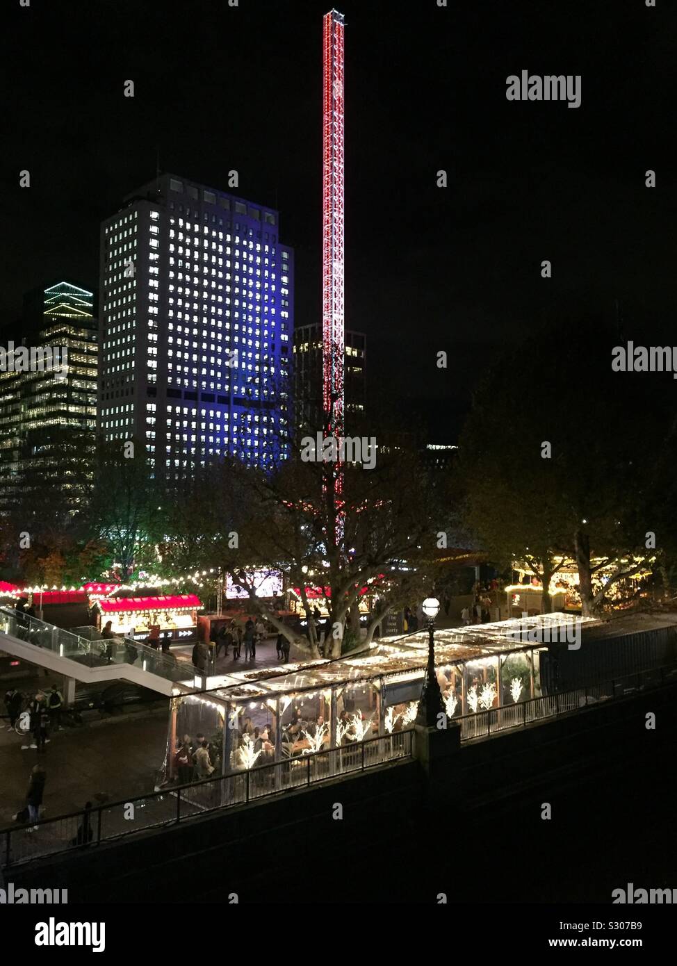 Southbank, London, England. Restaurant and Christmas market by the river Thames. View from Embankment. - Smartphone Captured Stock Image