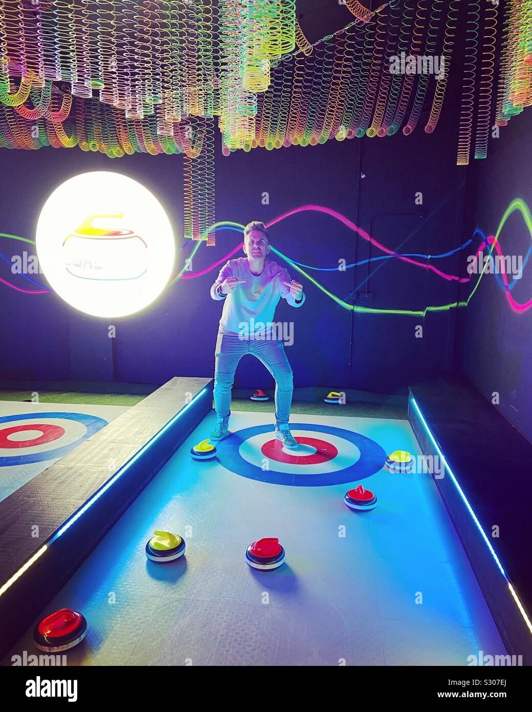 Man giving the middle fingers while curling Stock Photo Alamy