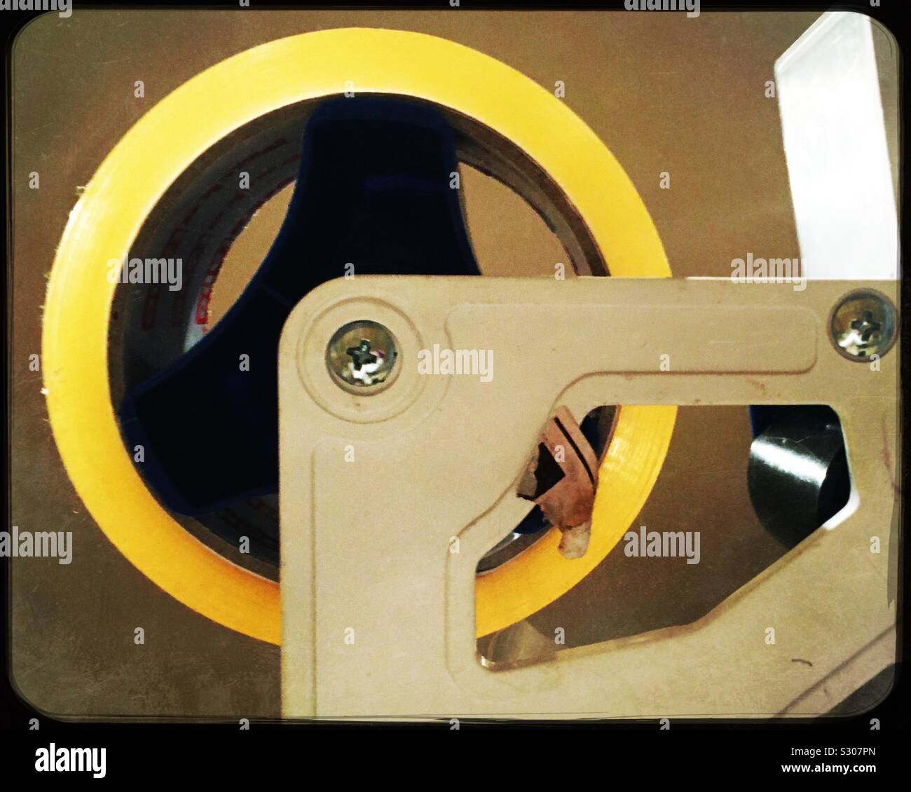 A parcel tape dispenser with a roll of clear tape Stock Photo Alamy