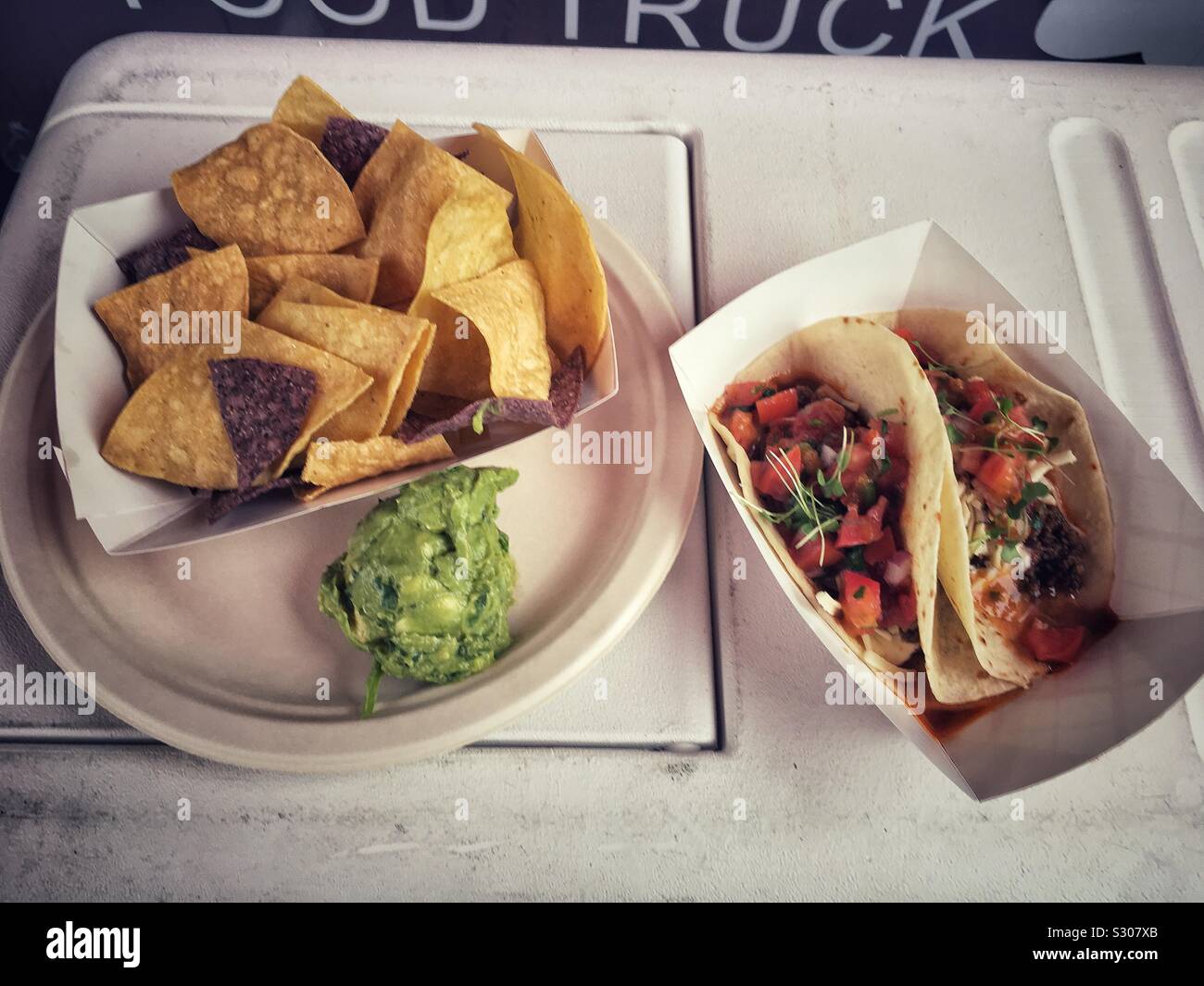Food Truck Tacos, Chips and Guacamole Stock Photo
