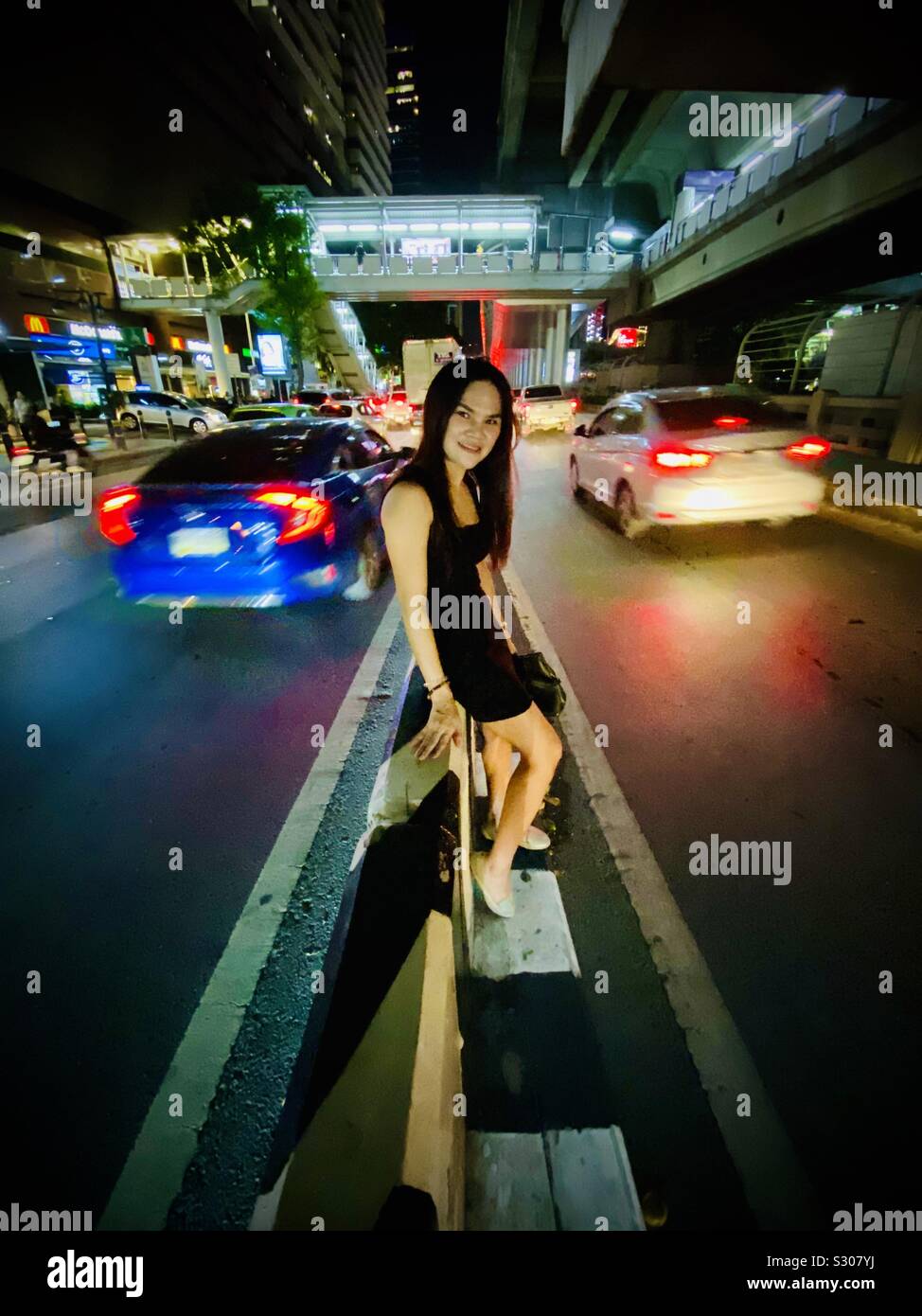 Asian girl in black dress portraite in street - Smartphone Captured Stock Image